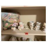 Shelf of Precious Moments collectibles, book