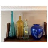 Colored bottles, cobalt vase