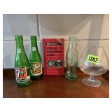 7 UP, Coca Cola bottles, bartender book
