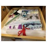 Craft supplies, stencils, rotary cutter, rulers,