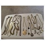 Gold costume, pendant necklaces