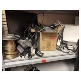 Shelf of miscellaneous items. Including speaker