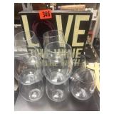 10 Plastic wine glasses with wooden sign.