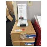 Two shower curtains with two boxes of place mats.