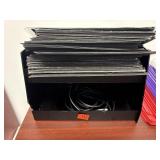 Plastic shelf with black folders, clipboard, more