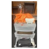 Plastic drawers loaded with decor, trays, fabric