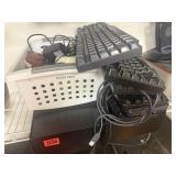 Cash drawer with basket of cords and keyboards