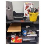 shelf with misc office supplies, air freshener,