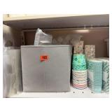 Tote filled with plates, empty boxes, paper candy