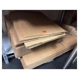 A large stack of shipping boxes, various sizes,
