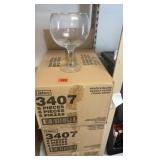 Cases of oversized margarita glasses