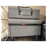 2 Cricut travel cases, one on wheels.