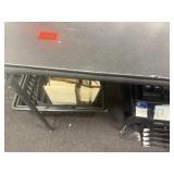 Foldable black table with plastic basket