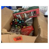 Box of Christmas ornaments and shot glasses