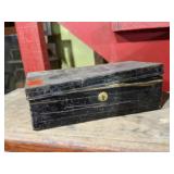 Metal box of shoe shine supplies