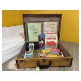 Suitcase, maps, books, literature