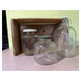 Fruit crate, jars, glass jug