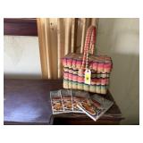 Multi colored covered basket, cookbooks