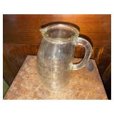 Glass potbelly measuring pitcher