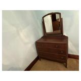Dresser with attached mirror