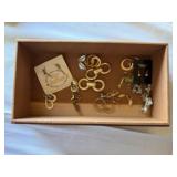 Wooden box of costume jewelry earrings