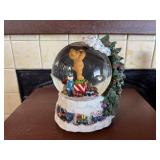 Musical holiday snow globe