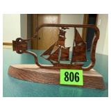 Wood carved sailboat in a bottle