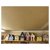 Shelf of handcrafted birdhouses (8)