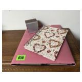 Pink portfolio, notebook, vintage alarm clock