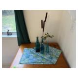 Placemats, teal bottles, cat tails, butterflies