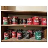 Collection of empty coffee cans (both shelves)