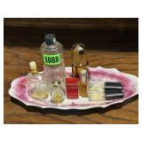 Pink china dish, perfume bottles