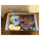 Box of yarn, knitting needles