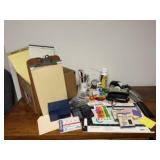 Assorted office supplies, legal pads, staplers