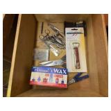 Scissors, wax, corkscrew, label maker, key holders