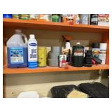 Shelf of consumables, window cleaner, duct tape