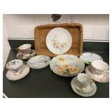 China tea cups, saucers, wicker basket