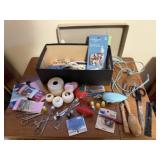 Box of sewing notions, sock darner, scissors