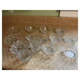 Assorted glassware, dessert bowls, cream, sugar,