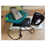 Cutting boards, hand mixer, grater, colander