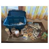 Tote of craft supplies, beads, buckles, pins