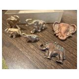 Gold elephant collectibles, pins