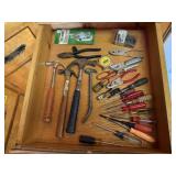 Contents of tool drawer, hammers, screwdrivers,