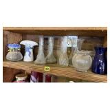 Shelf of floral vases