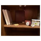 Shelf of office supplies, label maker, index cards