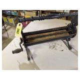 Antique cast iron paper roller