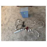 Bin of power cords, surge protectors, night