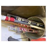 Trash can, American flags, yardstick, drill bit