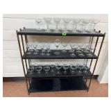 Black metal shelving unit, glassware collection