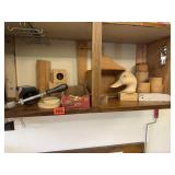 Shelf of incomplete wood carvings, scraps,